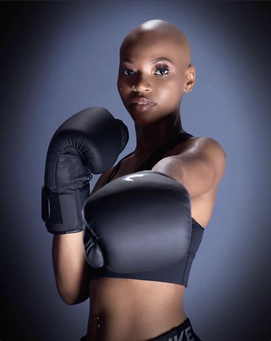 Cameron Hilliard in boxing gloves, studio portrait